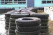 Surplus tires sit outside a tire factory awaiting use.